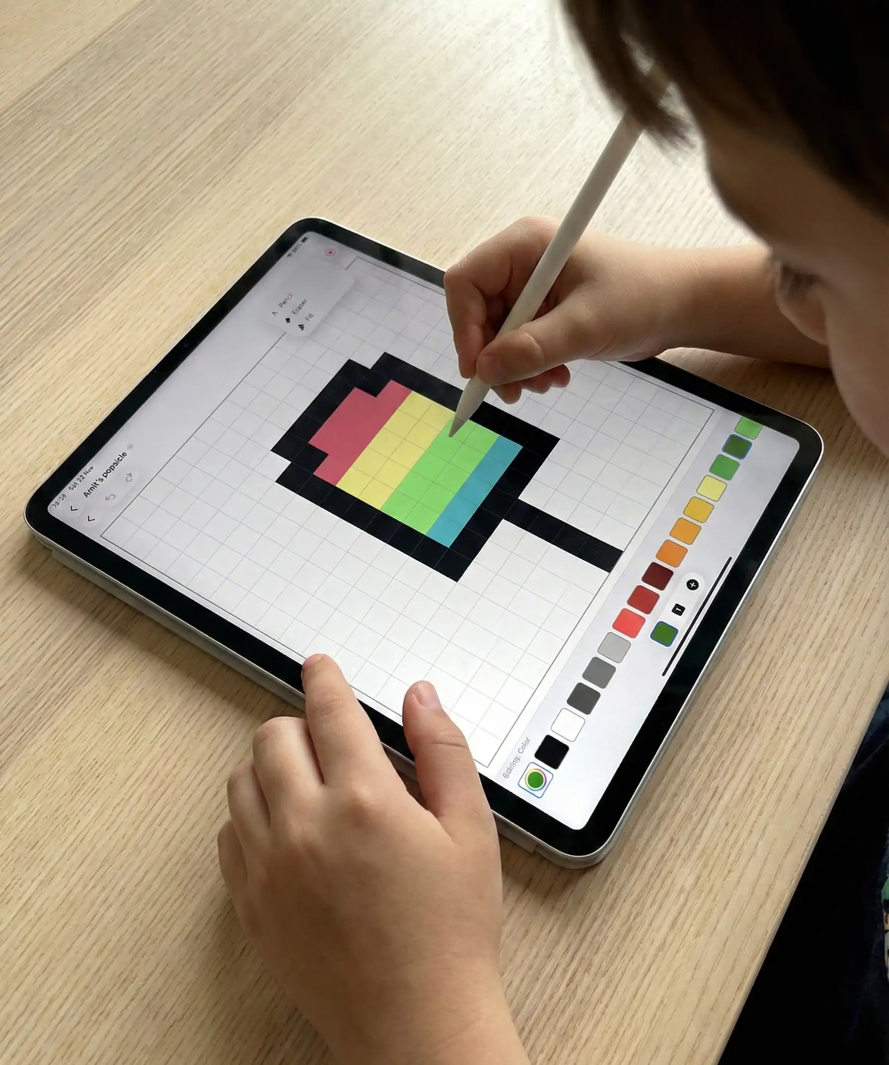 Child drawing with Amit Draws Pixels on iPad